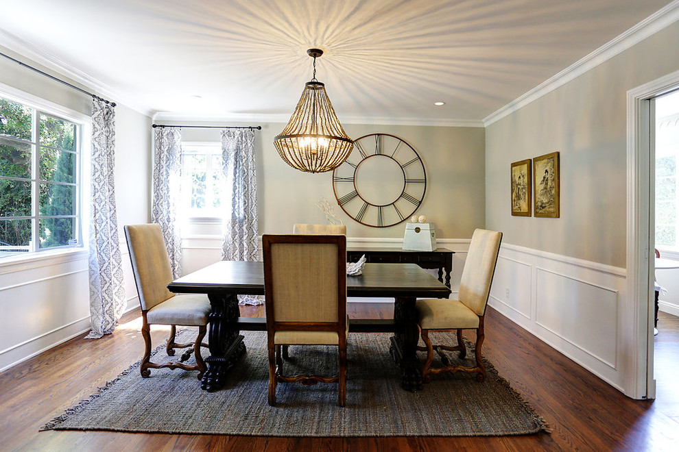 Dining room - mid-sized traditional medium tone wood floor dining room idea in Los Angeles with gray walls