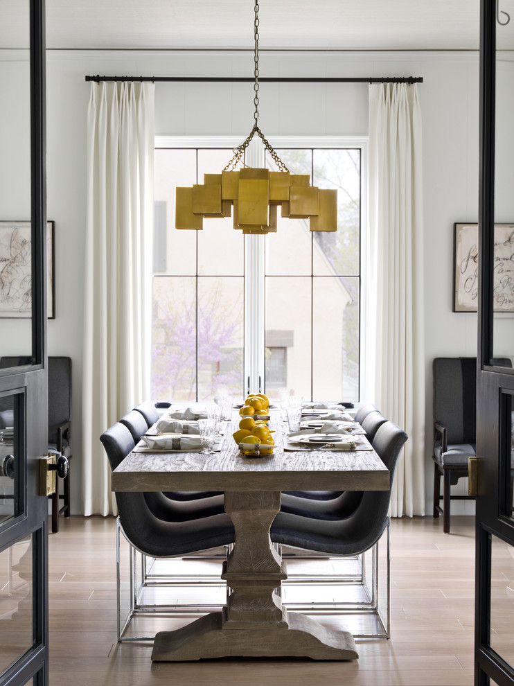 This is an example of a farmhouse dining room in Chicago.