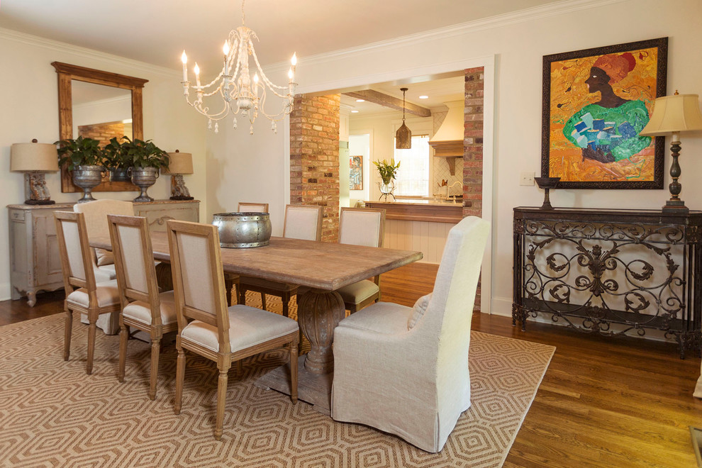 Small traditional dining room in Other with light hardwood flooring.