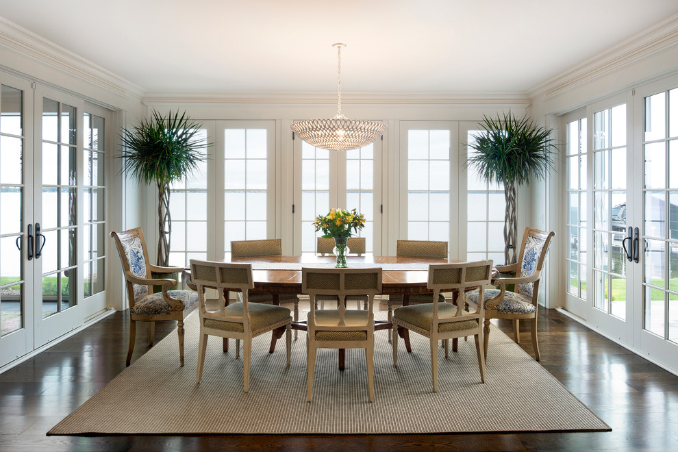 This is an example of a medium sized traditional open plan dining room in Minneapolis with white walls, dark hardwood flooring, no fireplace and brown floors.