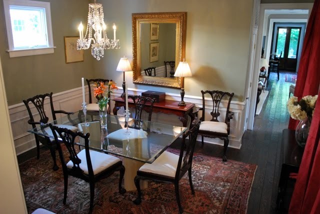 Photo of a traditional enclosed dining room in Charleston with dark hardwood flooring.
