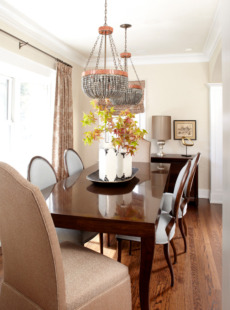 Photo of a classic enclosed dining room in Chicago with beige walls and medium hardwood flooring.