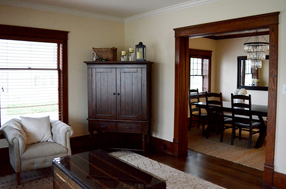 Medium sized classic enclosed dining room in Detroit with beige walls and dark hardwood flooring.
