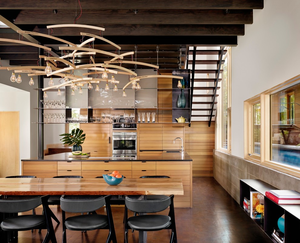 Ispirazione per una sala da pranzo aperta verso la cucina design