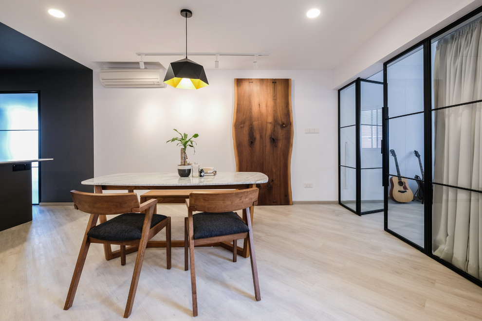 Inspiration for a contemporary light wood floor and beige floor dining room remodel in Singapore with white walls