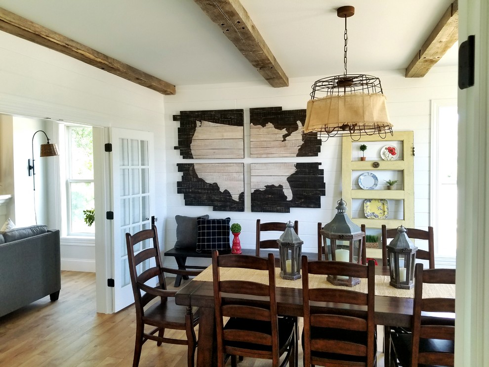Mid-sized farmhouse medium tone wood floor and brown floor kitchen/dining room combo photo in Other with white walls and no fireplace