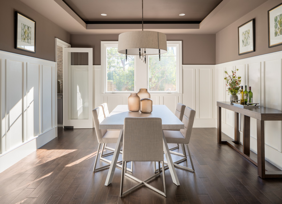 Inspiration for a mid-sized transitional dark wood floor enclosed dining room remodel in Los Angeles with gray walls