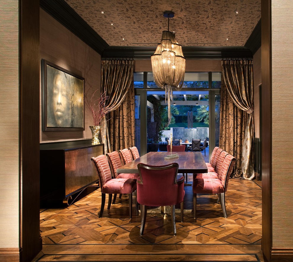 Design ideas for a modern dining room in San Diego with dark hardwood flooring.