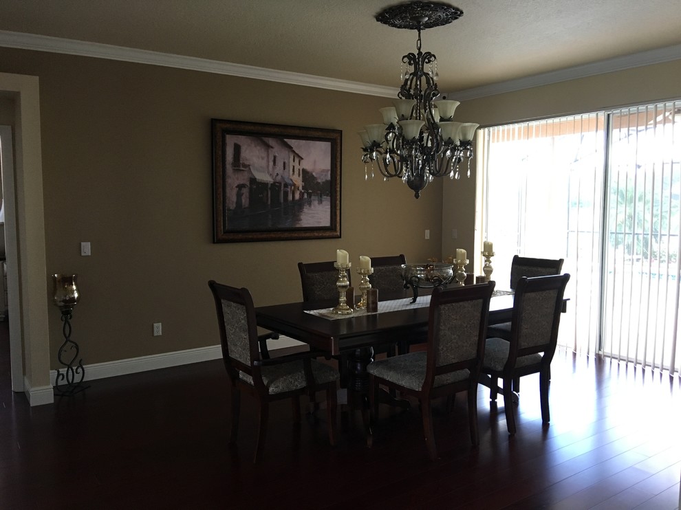 This is an example of a large traditional kitchen/dining room in Orlando with brown walls, medium hardwood flooring and brown floors.