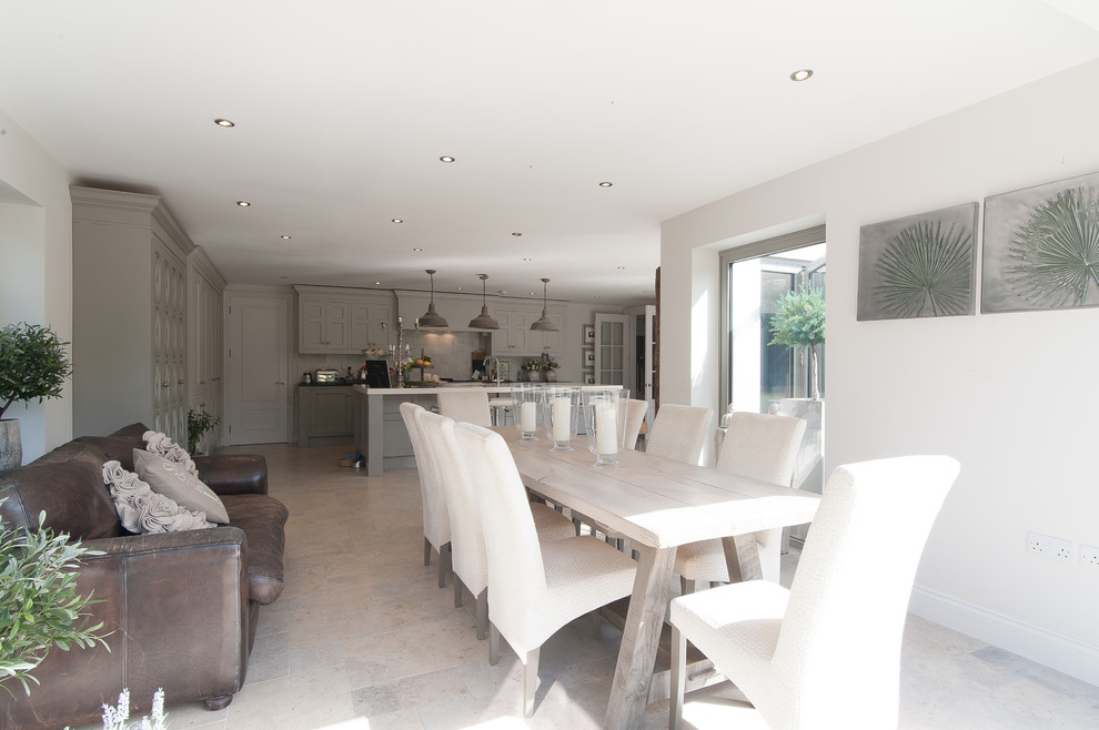 Example of a transitional dining room design in Surrey