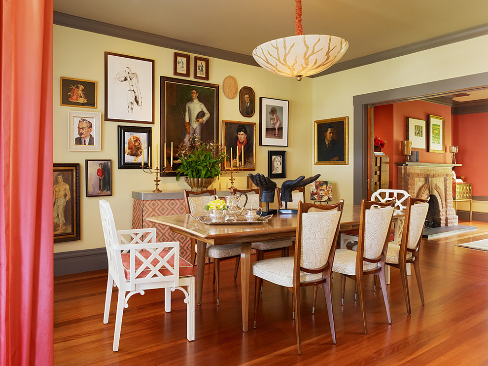 Inspiration for an eclectic dining room remodel in San Francisco with yellow walls