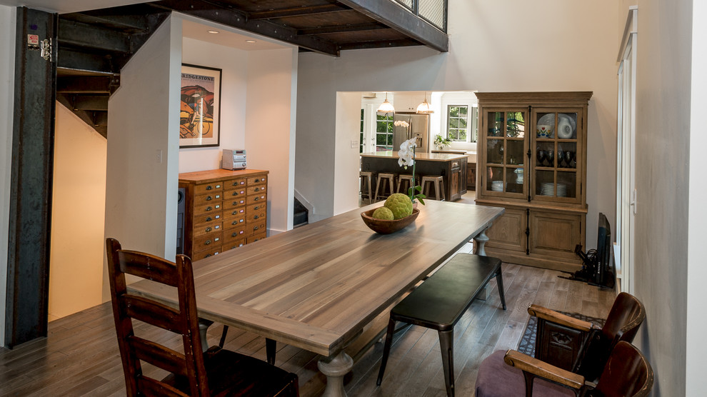 This is an example of a rural kitchen/dining room in Seattle with beige walls and medium hardwood flooring.
