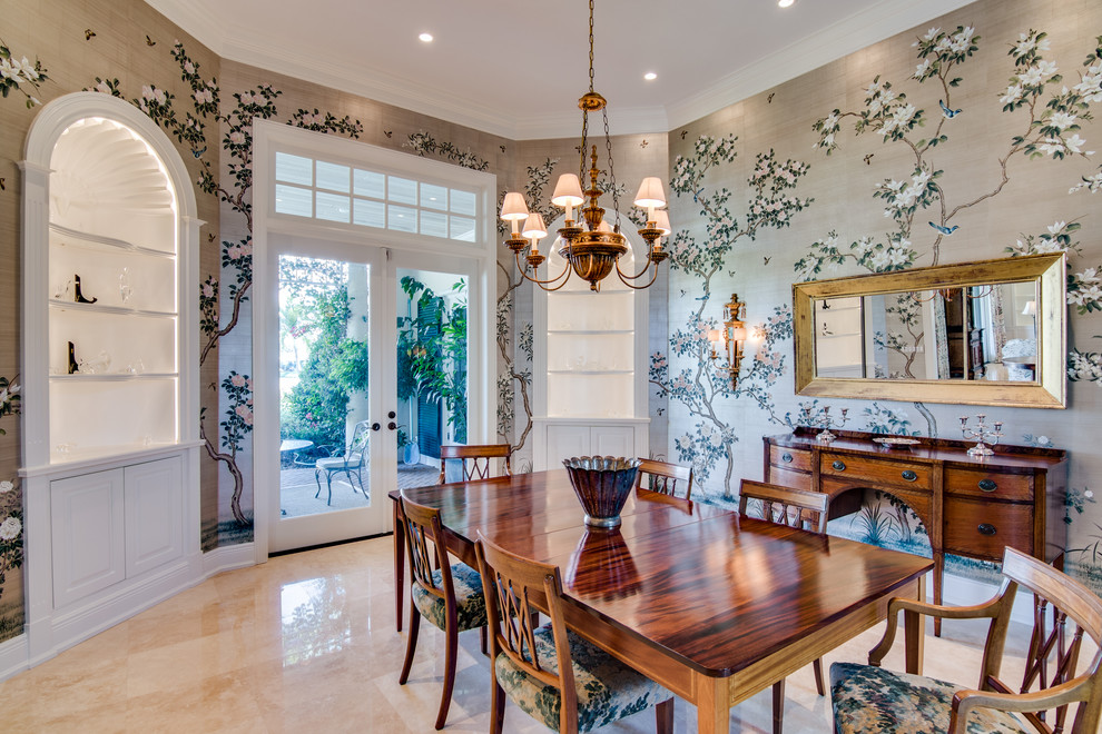 Example of a classic travertine floor enclosed dining room design in Miami with multicolored walls and no fireplace
