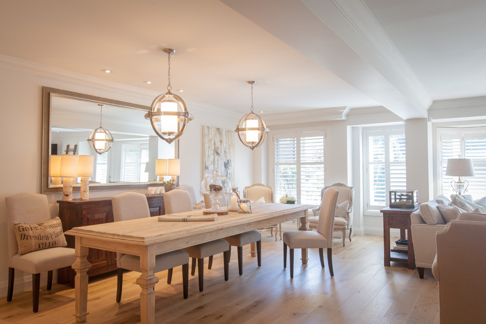 Photo of a country dining room in Toronto with beige walls, light hardwood flooring and no fireplace.