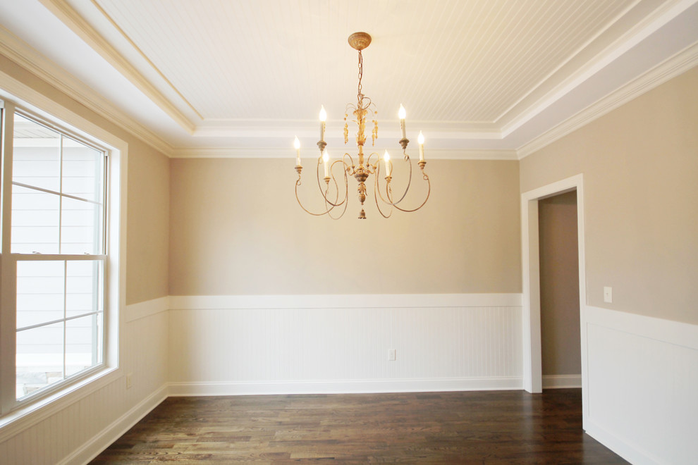 Enclosed dining room - craftsman medium tone wood floor enclosed dining room idea in Other with beige walls