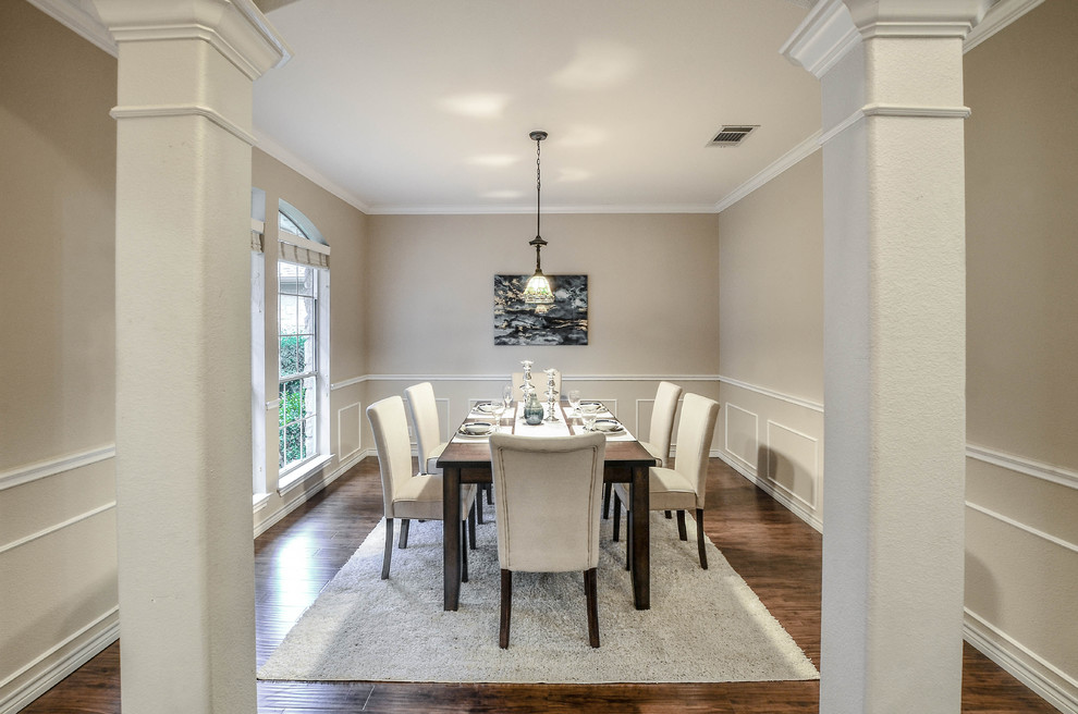Example of a transitional dining room design in Austin