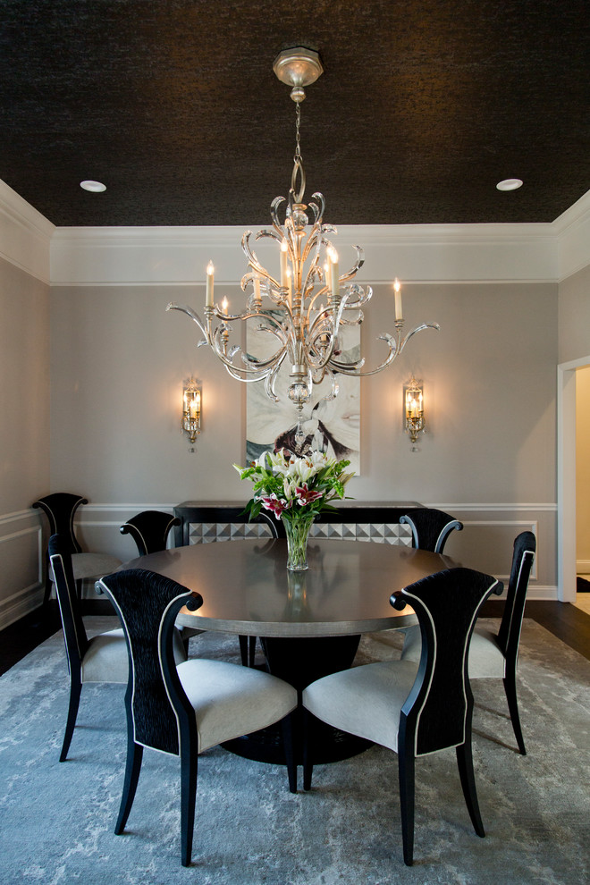 Large traditional enclosed dining room in St Louis with beige walls, dark hardwood flooring and brown floors.