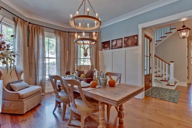 Enclosed dining room - mid-sized traditional light wood floor enclosed dining room idea in Charlotte with blue walls