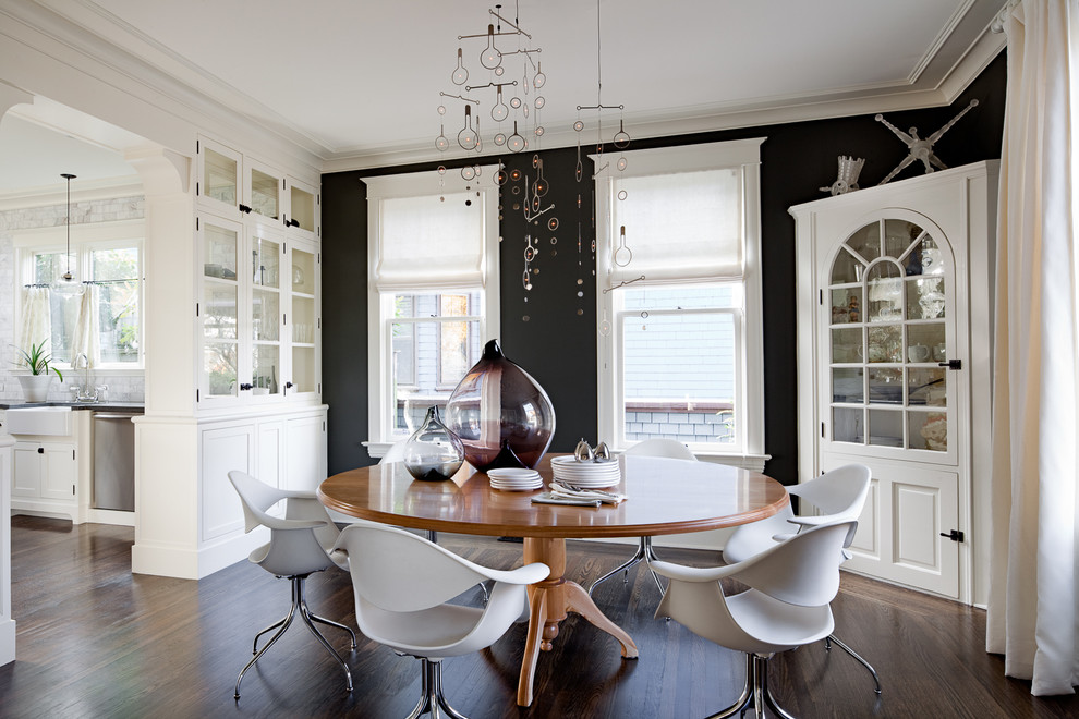Inspiration for a contemporary dining room in Portland with black walls.