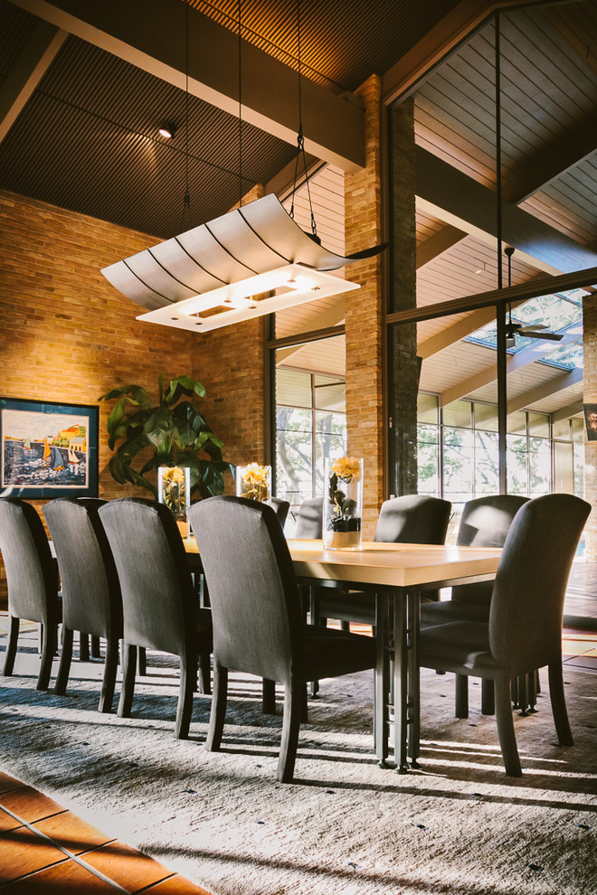This is an example of a contemporary open plan dining room in Austin.