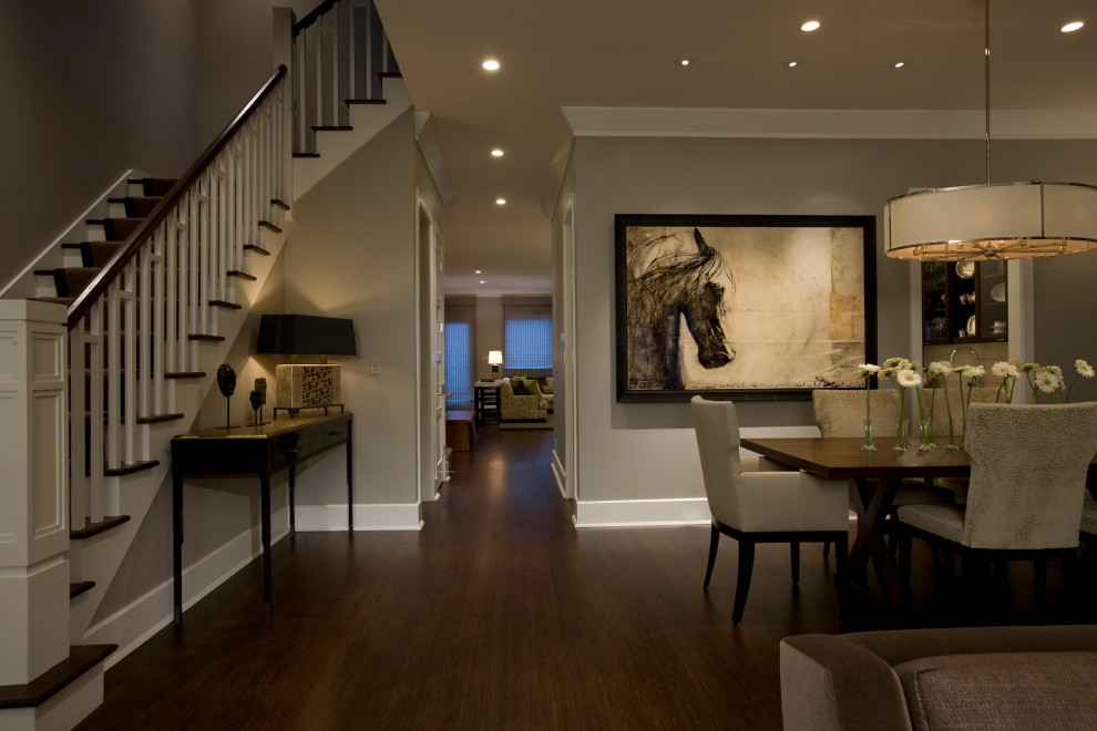 Photo of a contemporary enclosed dining room in Chicago with grey walls, dark hardwood flooring and brown floors.