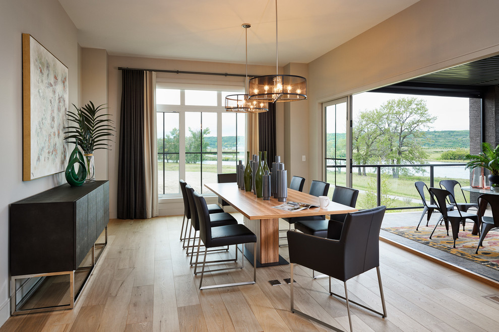 Example of a trendy light wood floor dining room design in Calgary