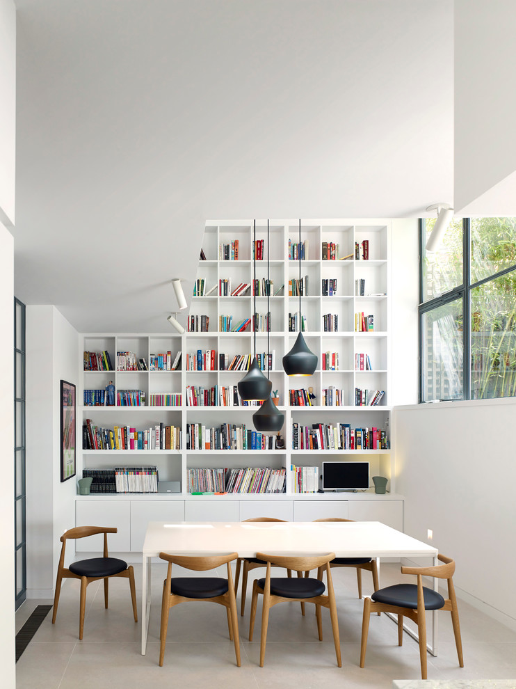 Inspiration for a scandinavian dining room remodel in London with white walls