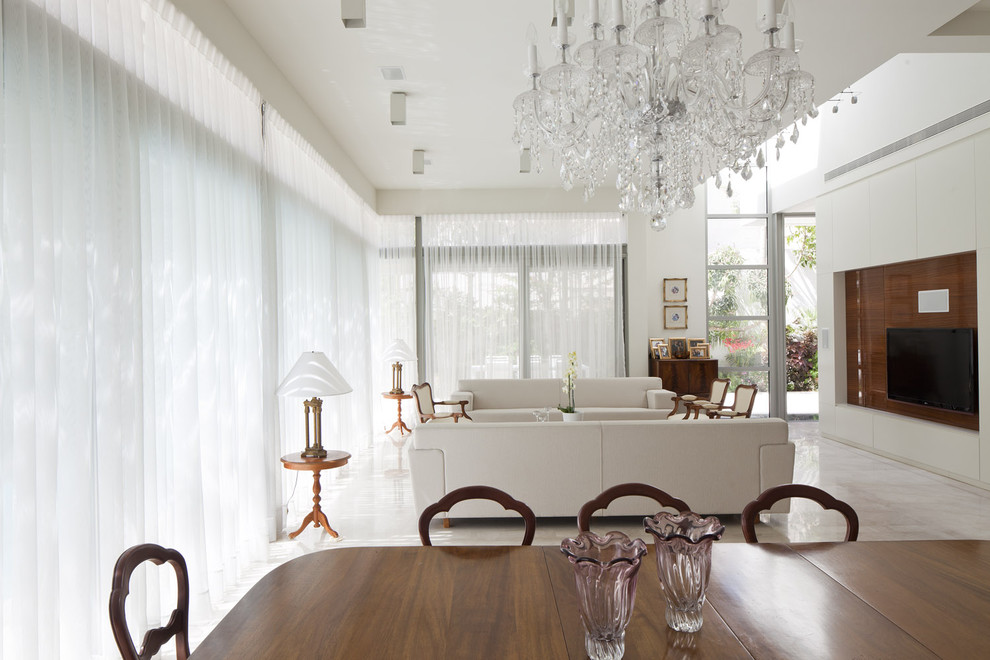 Photo of an expansive modern open plan dining room in Tel Aviv with white walls, limestone flooring and no fireplace.