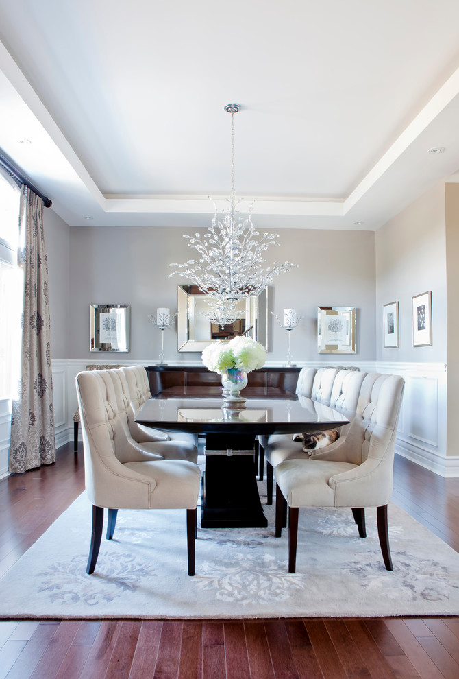 Example of a transitional brown floor dining room design in Montreal with gray walls and no fireplace