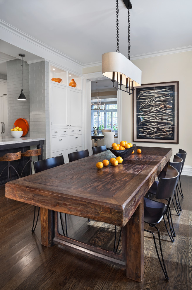 Example of a transitional dark wood floor and brown floor kitchen/dining room combo design in Chicago with beige walls