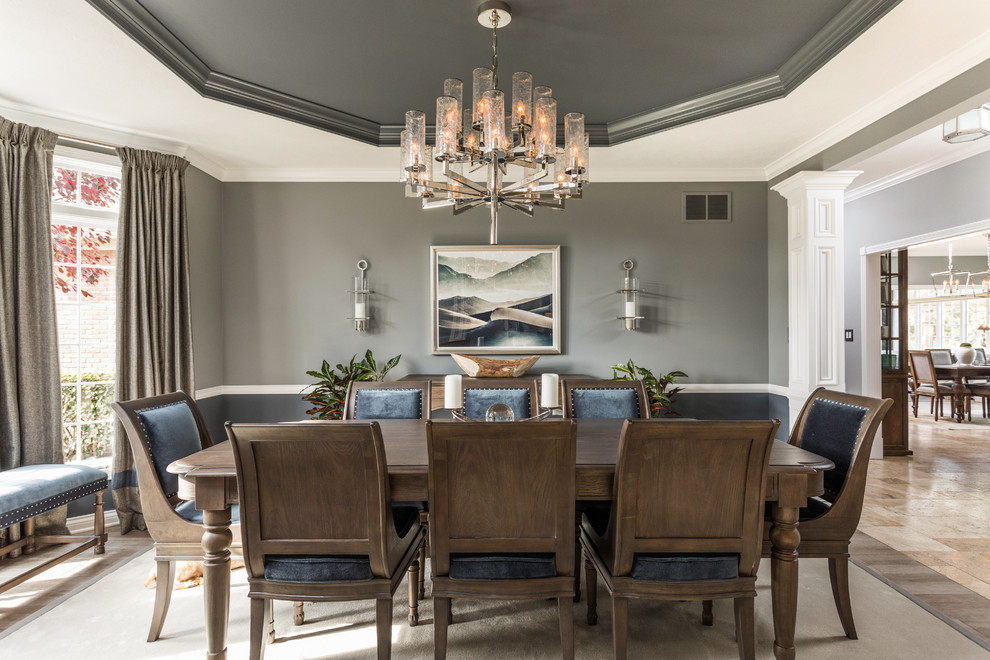 Inspiration for a medium sized traditional enclosed dining room in New York with grey walls and light hardwood flooring.