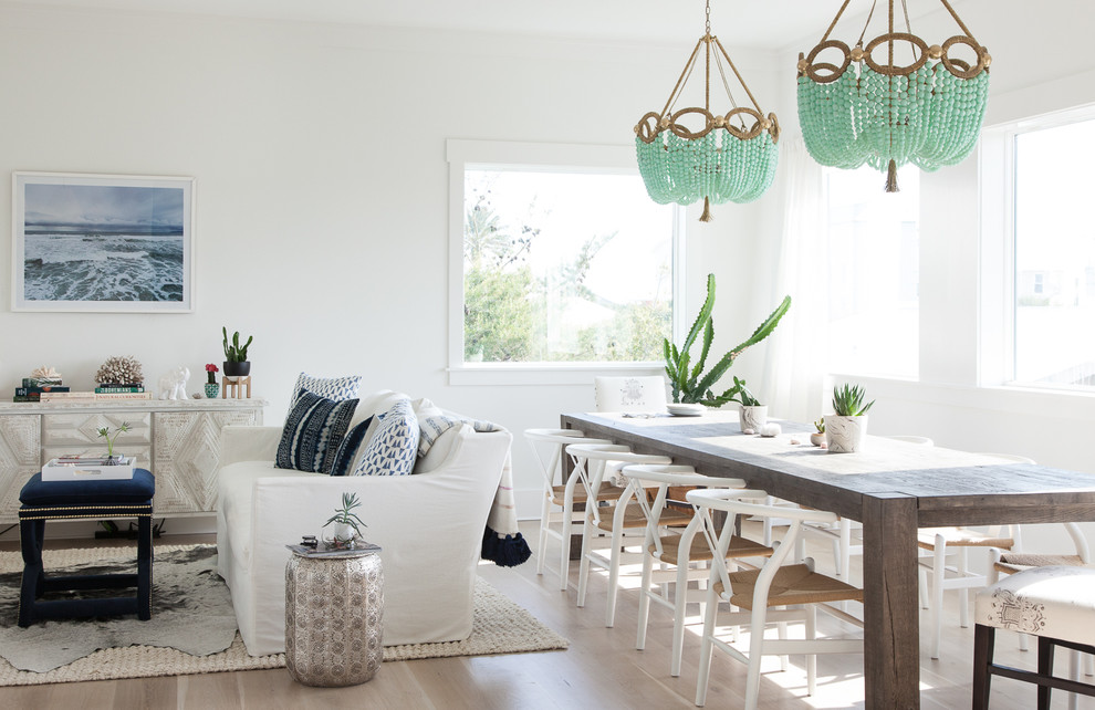 Inspiration for a coastal light wood floor great room remodel in Miami with white walls
