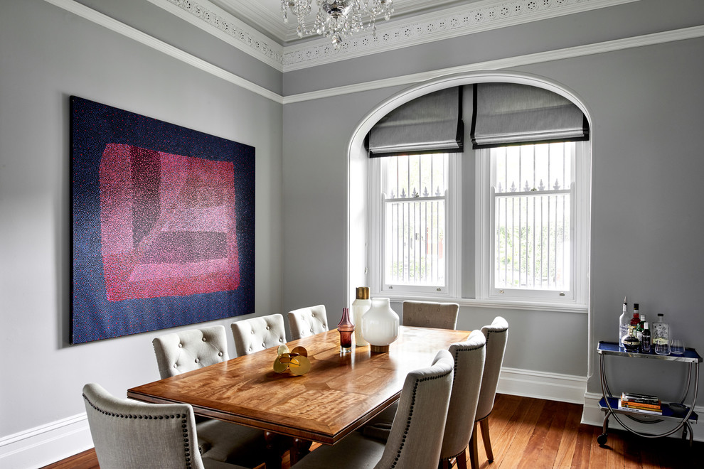 Inspiration for a large traditional dining room in Sydney with grey walls, medium hardwood flooring and brown floors.