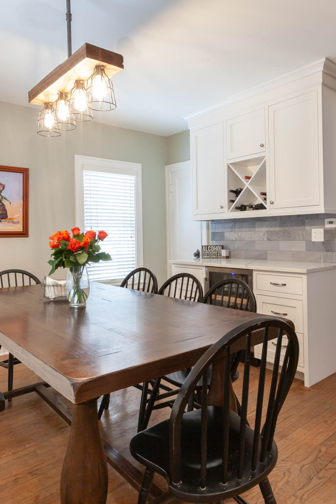 Photo of a medium sized traditional kitchen/dining room in Chicago with medium hardwood flooring, brown floors and grey walls.