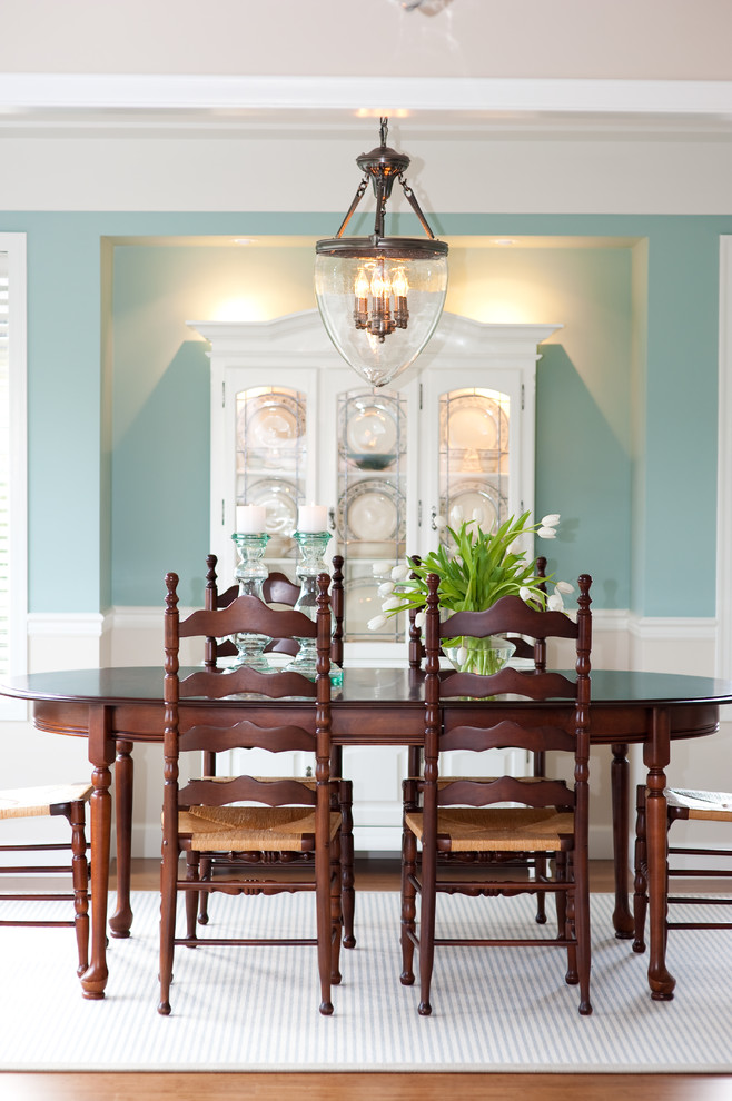 This is an example of a classic enclosed dining room in Vancouver with blue walls.
