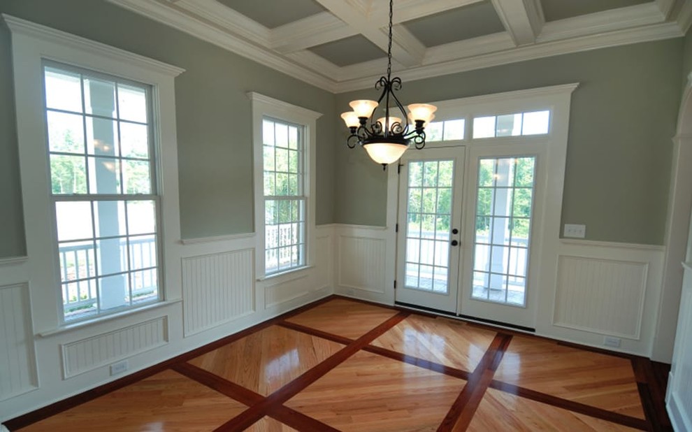Medium sized traditional enclosed dining room in San Francisco with grey walls, light hardwood flooring and no fireplace.