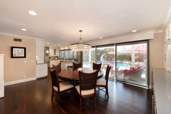 Inspiration for a large transitional dark wood floor and brown floor kitchen/dining room combo remodel in Orange County with brown walls and no fireplace