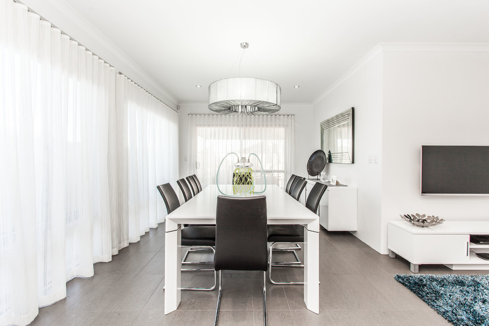 Esempio di una sala da pranzo aperta verso il soggiorno design con pareti bianche