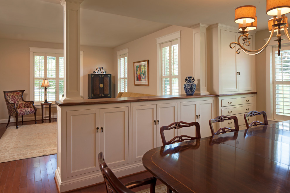 Example of a mid-sized classic medium tone wood floor kitchen/dining room combo design in Baltimore with beige walls
