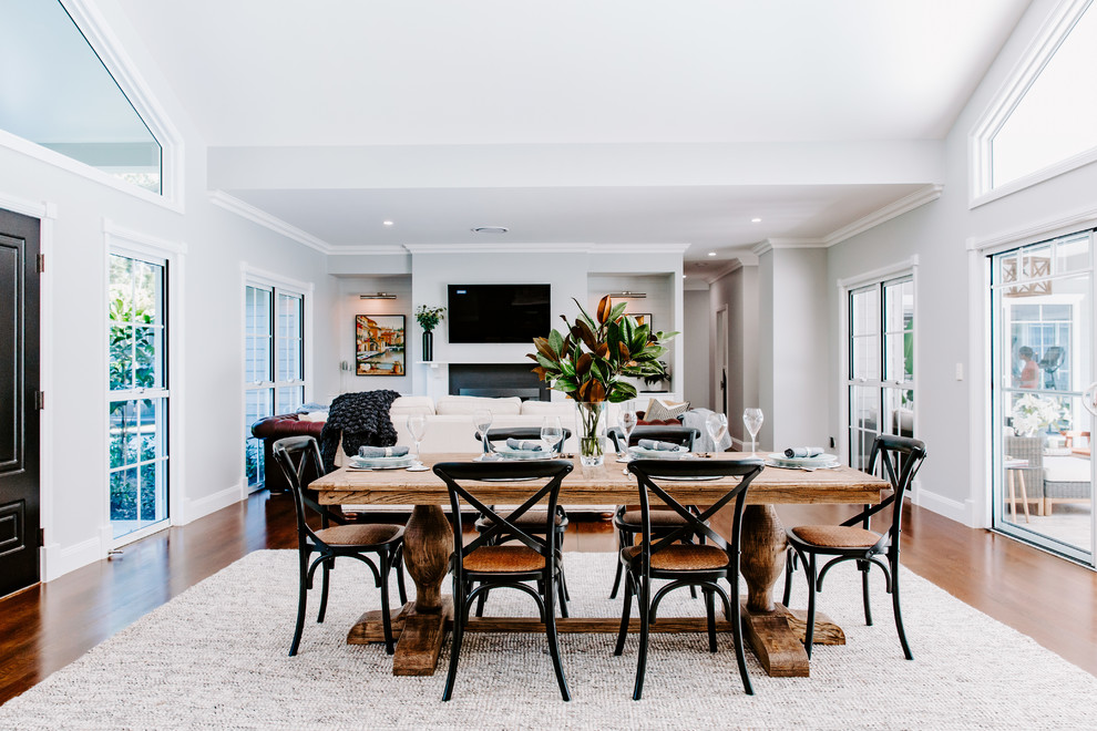 Inspiration for a contemporary open plan dining room in Sunshine Coast with grey walls, dark hardwood flooring and brown floors.
