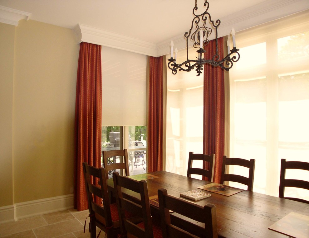 Photo of a large contemporary enclosed dining room in Toronto with beige walls and travertine flooring.