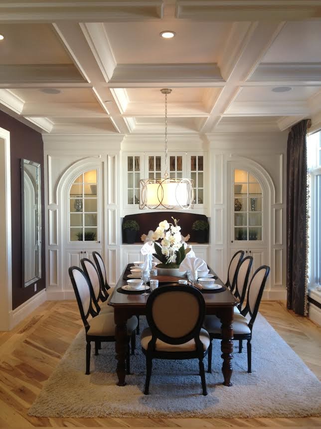 Photo of a medium sized traditional enclosed dining room in San Diego with brown walls, light hardwood flooring, no fireplace and beige floors.