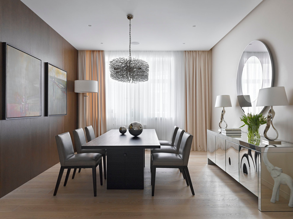 Design ideas for a contemporary open plan dining room in Moscow with light hardwood flooring and no fireplace.