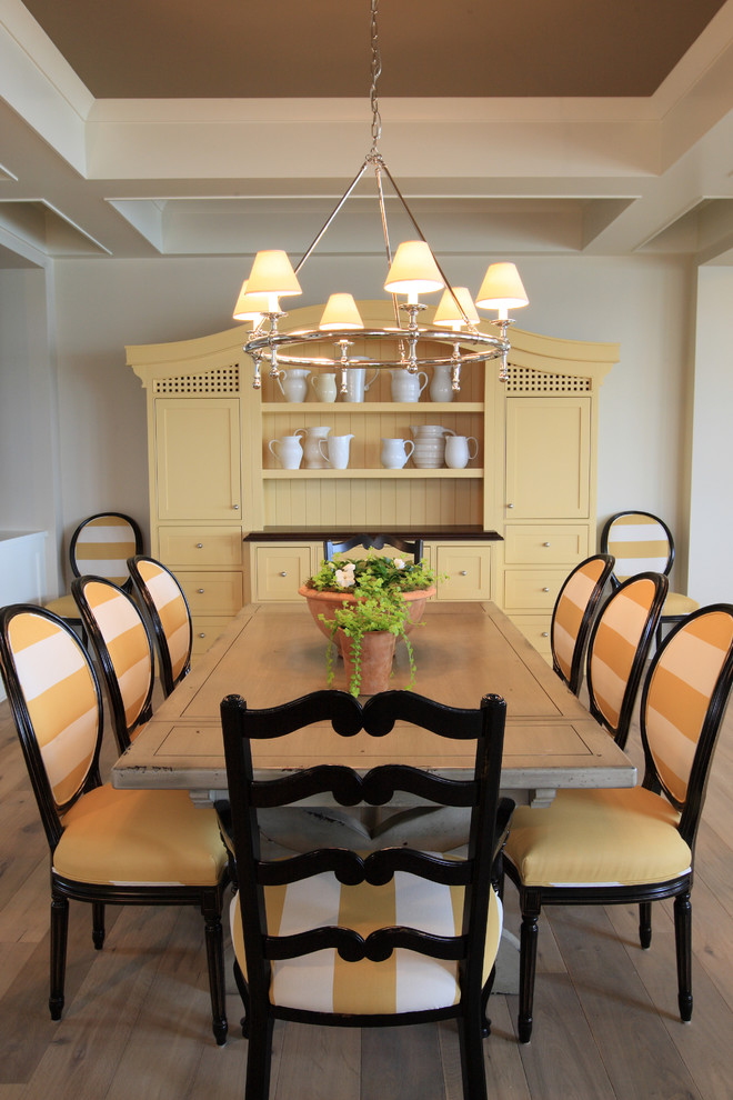 Inspiration for a timeless dark wood floor dining room remodel in Grand Rapids with beige walls