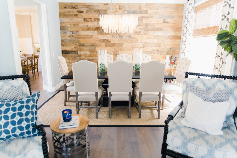 This is an example of a medium sized traditional dining room in Orange County with wood walls.