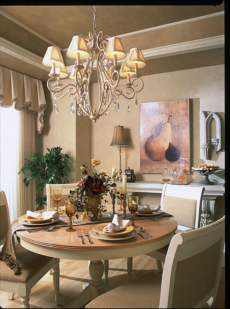 Mid-sized elegant light wood floor enclosed dining room photo in Milwaukee with beige walls and no fireplace