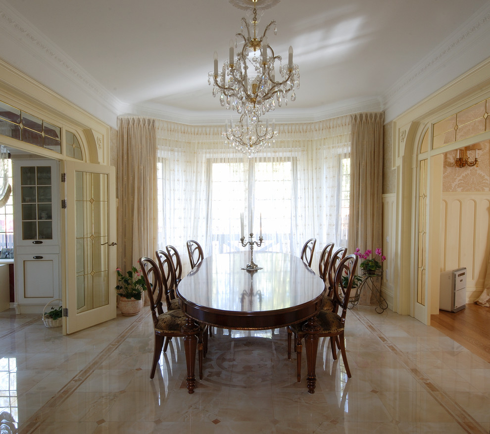 Photo of a large traditional enclosed dining room in Other with beige walls and marble flooring.