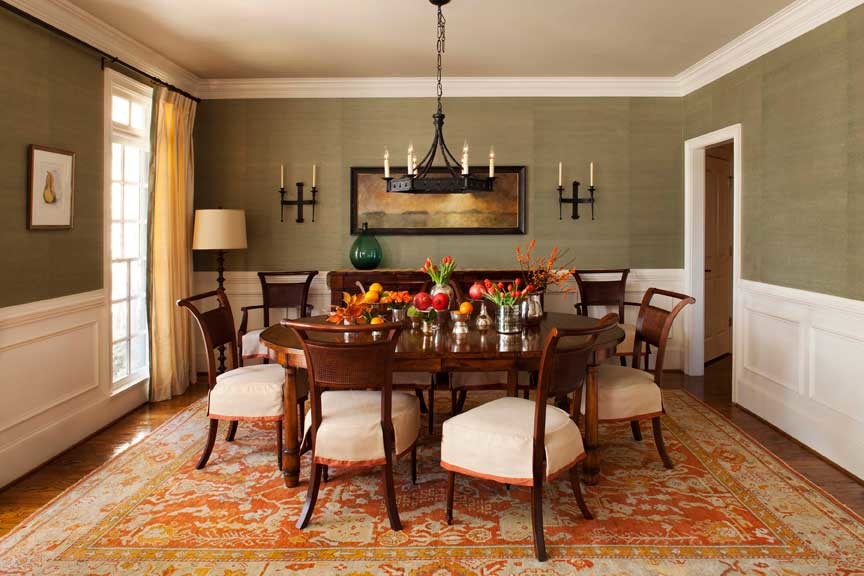 Inspiration for a mid-sized eclectic medium tone wood floor enclosed dining room remodel in Atlanta with green walls