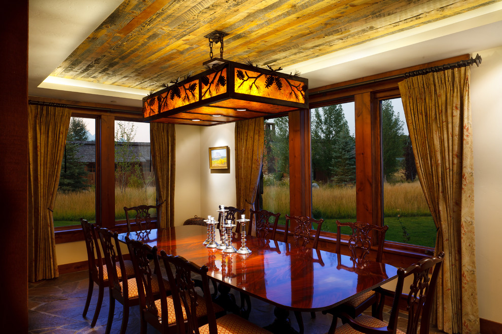 Dining room - rustic dining room idea in Denver