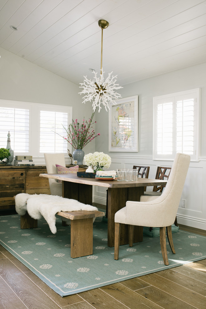 Inspiration for a transitional medium tone wood floor dining room remodel in Los Angeles with gray walls